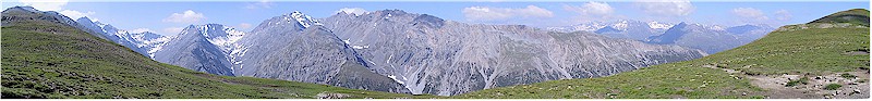 Panoramic view from ridge Murter towards the valley Cluozza with the rest area on Murter in the foreground and an impressive mountain range in the back